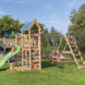 Speeltoestel Jungle Gym Nomad met groene glijbaan en klimrek van douglashout